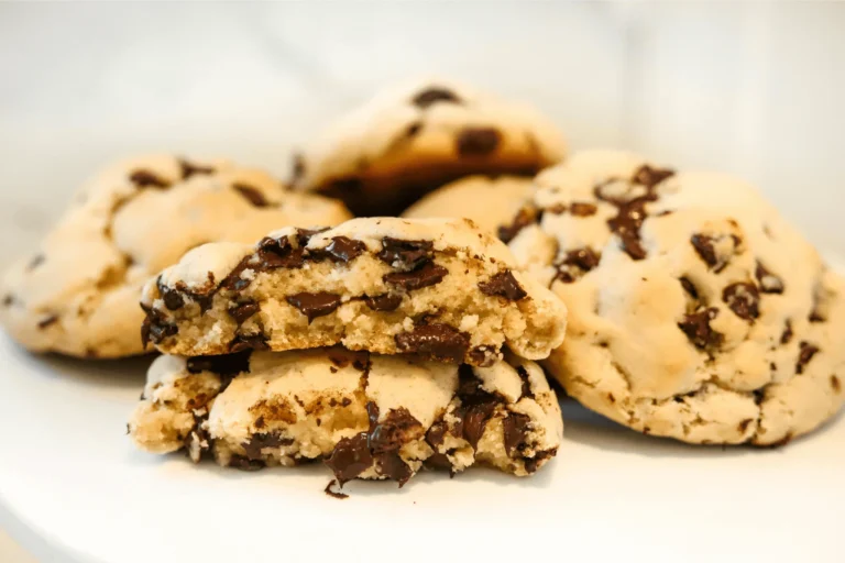 Freshly baked Mini Chocolate Cookies with melted chocolate chips on a rustic wooden table